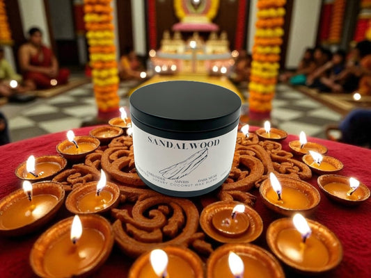 Sandalwood black candle tin with a background of Diwali decorations.