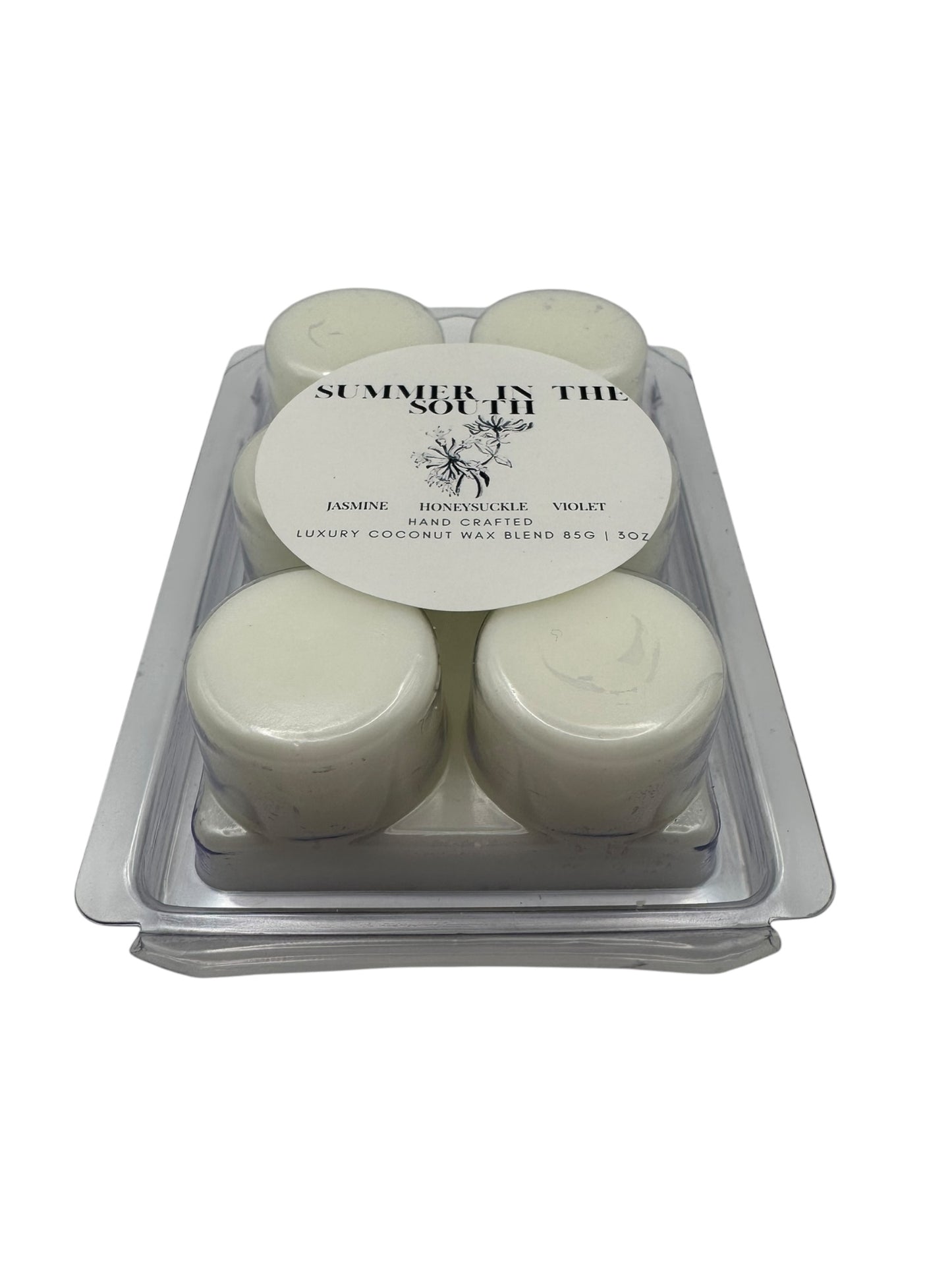 A white wax melt in a clear clamshell labeled Summer in the South on a white background.