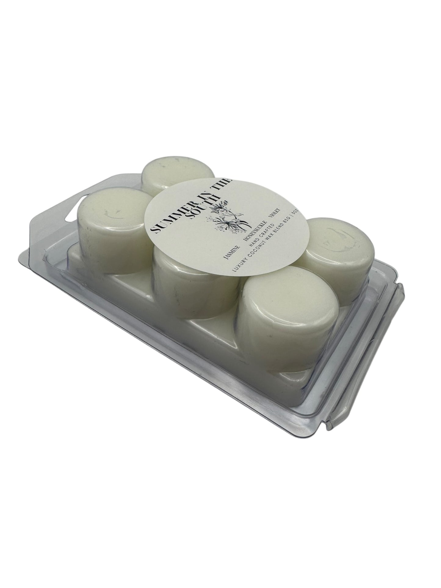 A white wax melt labeled Summer in the South side view on a white background.