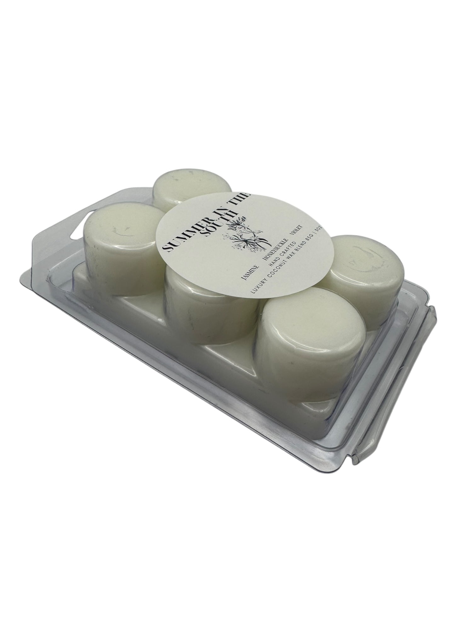 A white wax melt labeled Summer in the South side view on a white background.