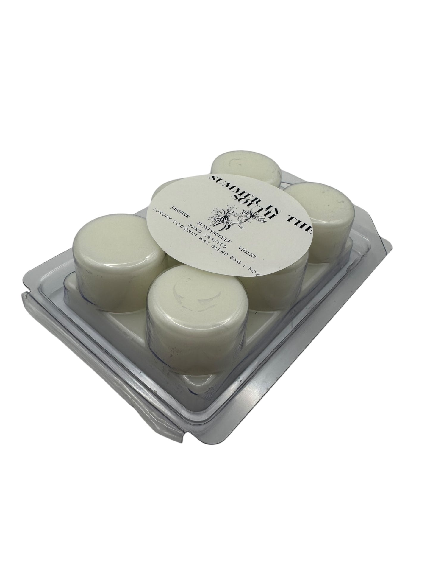A white wax melt labeled Summer in the South side view on a white background.