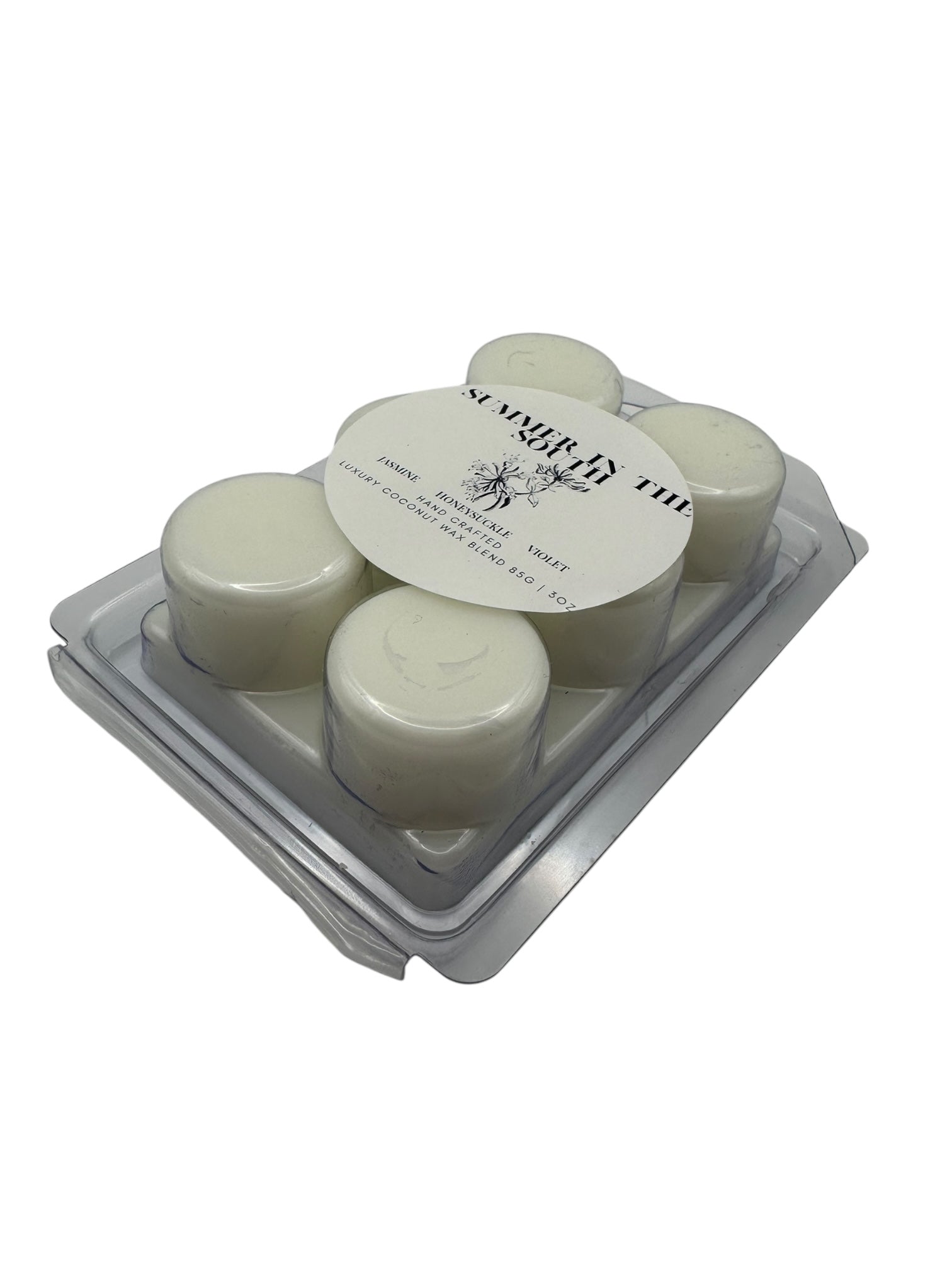 A white wax melt labeled Summer in the South side view on a white background.