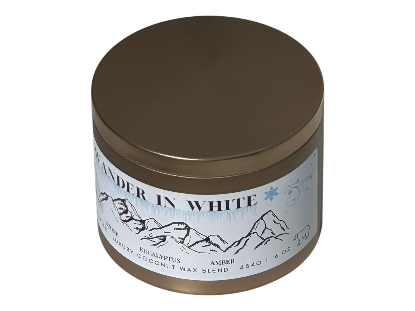 A gold candle tin labeled "Wander in White" on a white background.