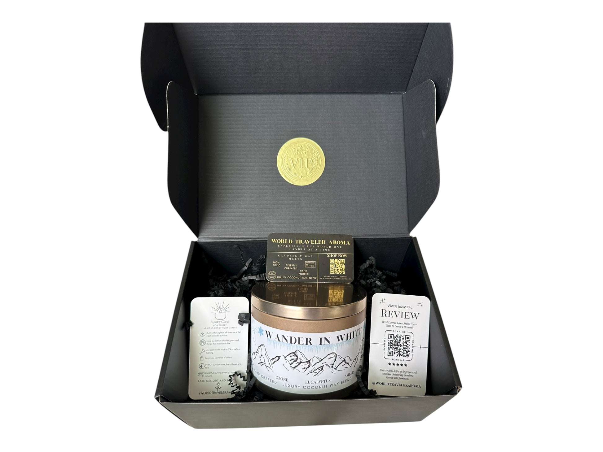 Candle in a black gift box with a visible brand logo on a white background.