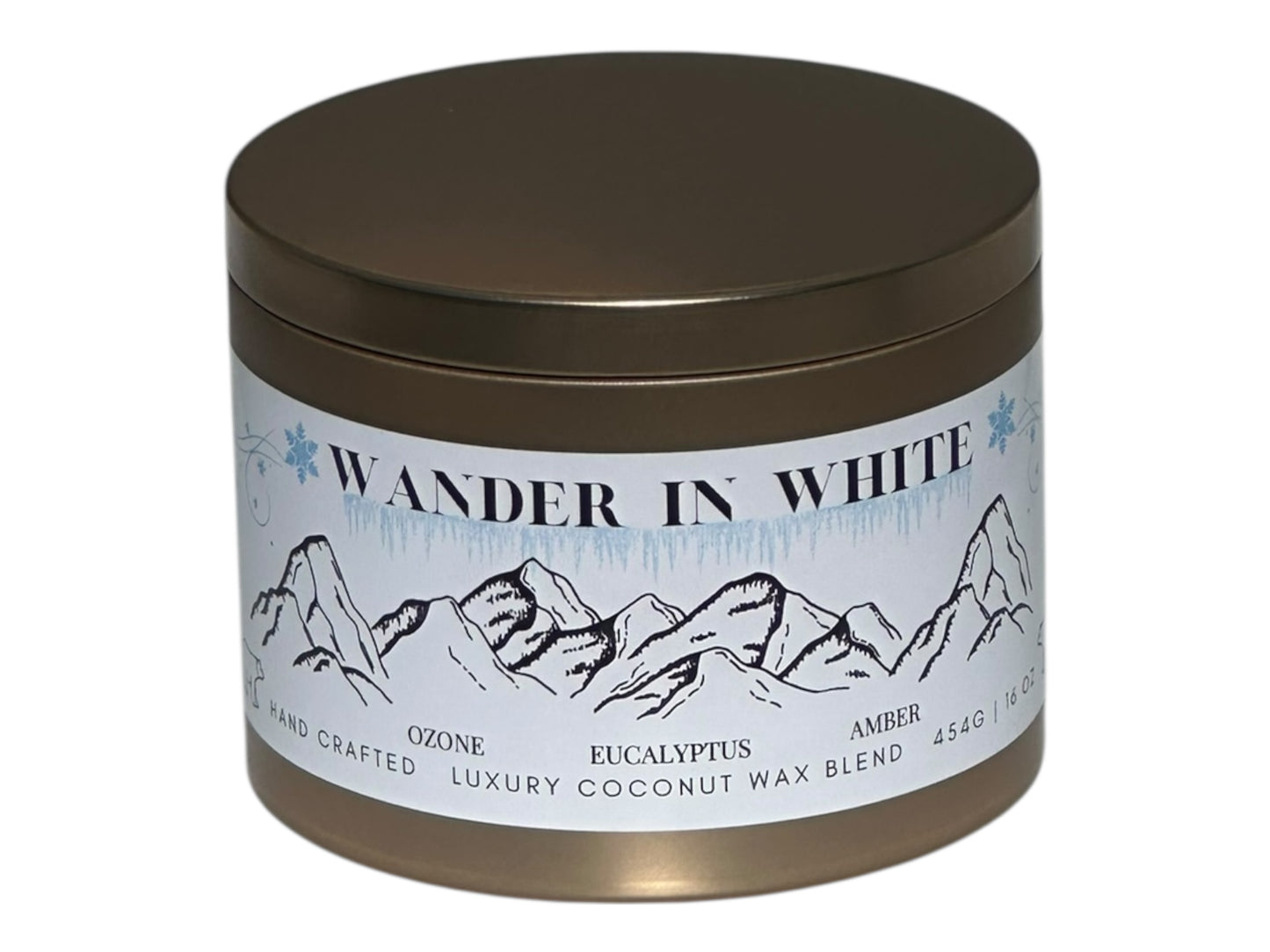 Candle jar with 'Wander in White' label featuring mountain design on a white background