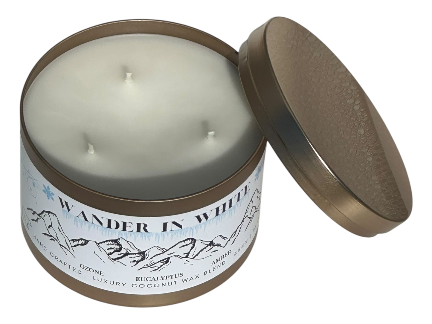 Candle in a tin with 'Wander in White' label on a white background