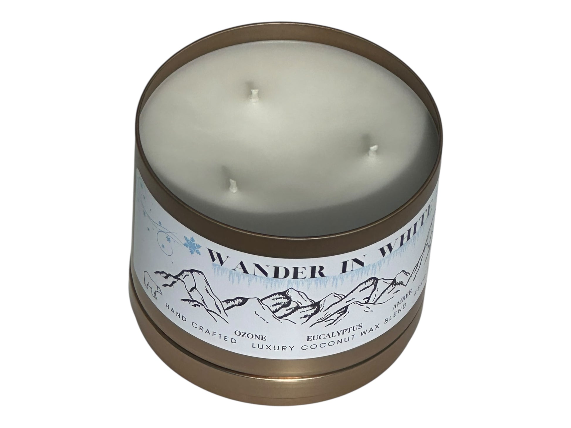 Candle in a tin with 'Wander in White' label on a white background
