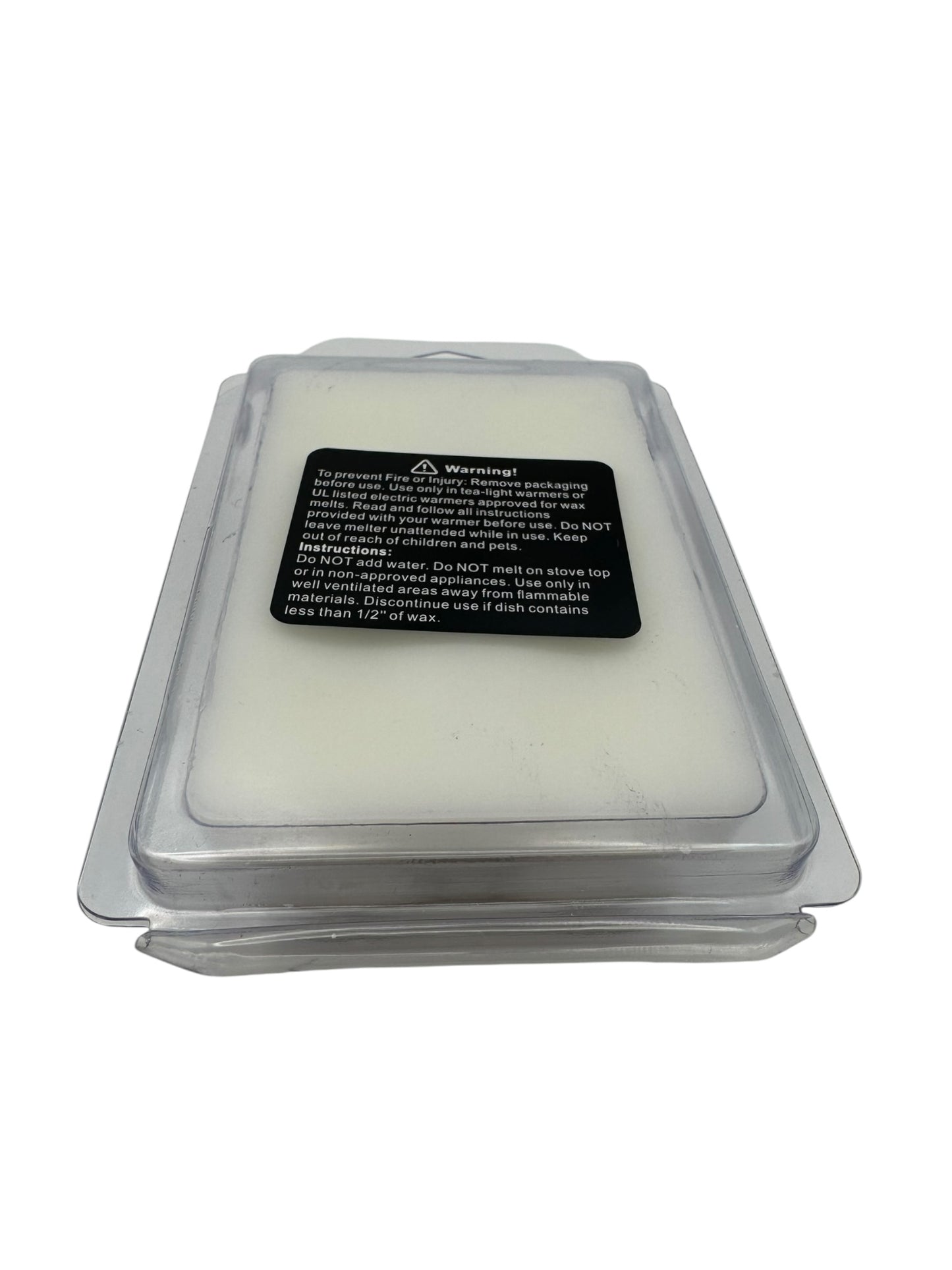 White wax melts in clear packaging with a warning label on a white background